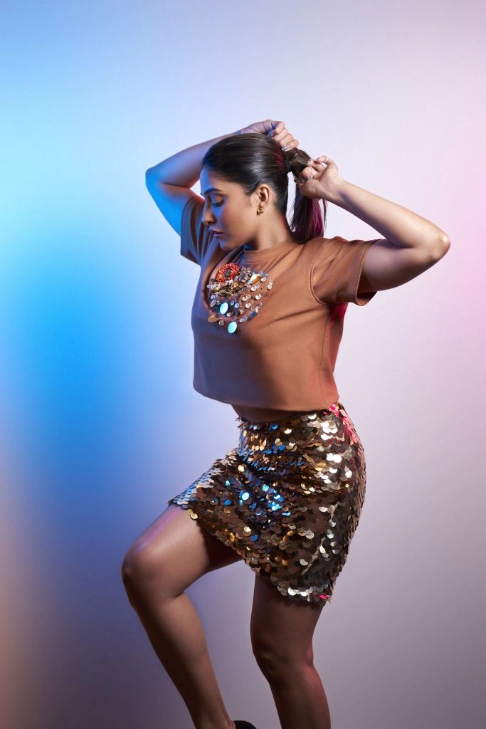 Regina Cassandra in Nirmooha's Crop T-Shirt with Sunflower Motif and Golden Sequin Short Skirt from the Ancienne Collection