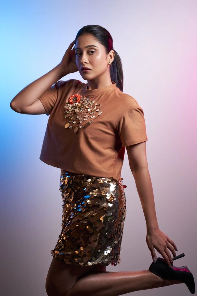 Regina Cassandra in Nirmooha's Crop T-Shirt with Sunflower Motif and Golden Sequin Short Skirt from the Ancienne Collection